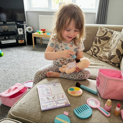 Little Girl playing pretend beauty salon