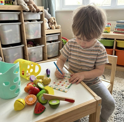 Child playing pretend shop